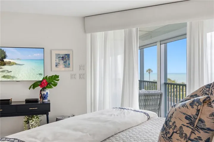 Primary bedroom with a coastal view.
