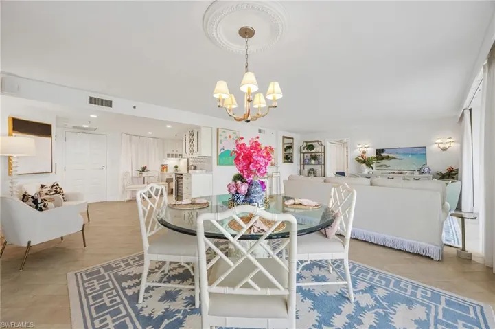 dining area with views of kitchen and living room.