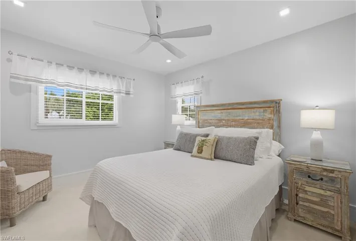 Bedroom with recessed lighting, a ceiling fan, and light carpet
