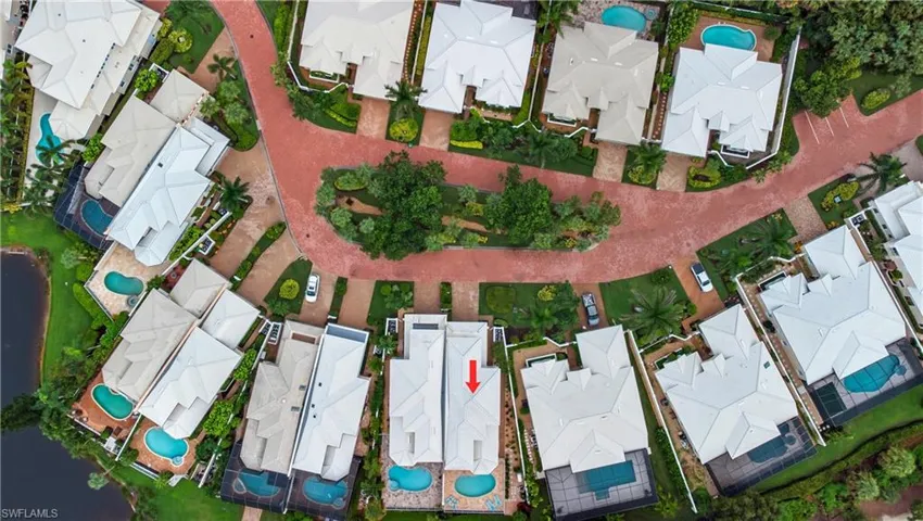 Aerial perspective of suburban area with a pool