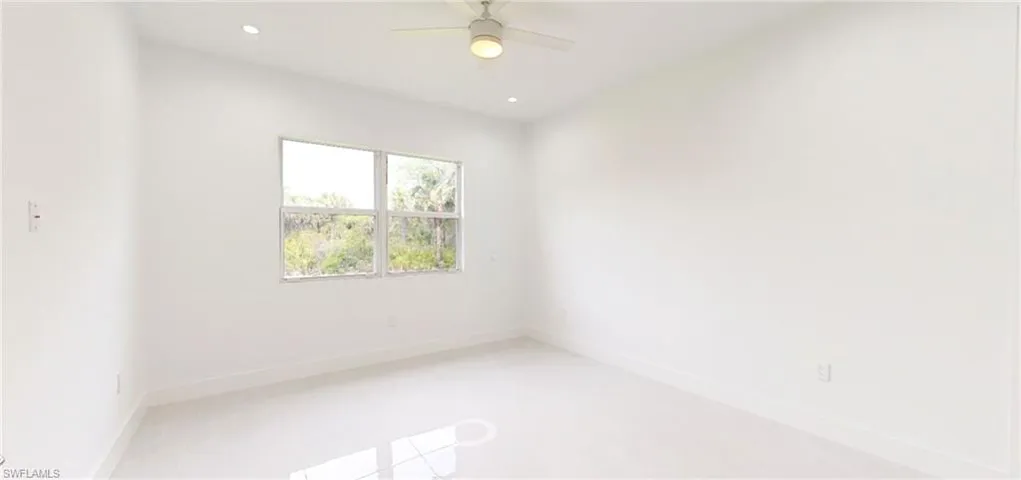 Unfurnished room with ceiling fan, baseboards, and recessed lighting