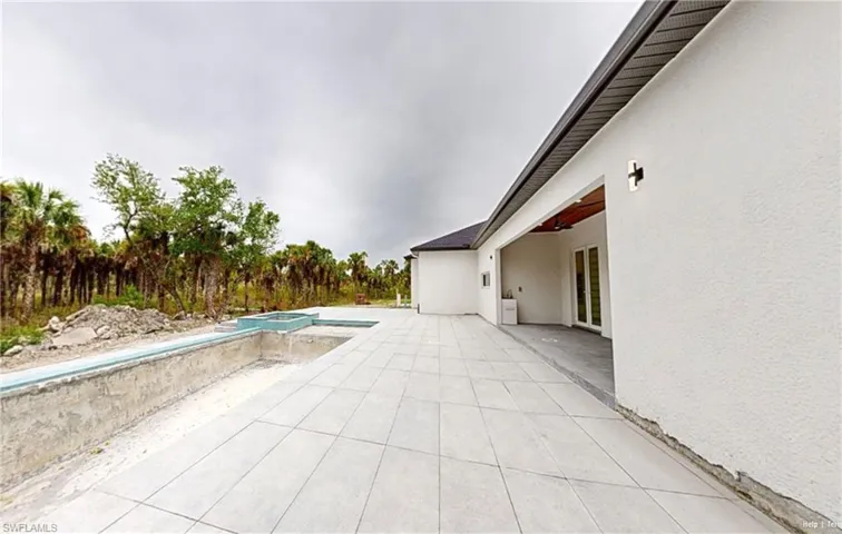 View of pool featuring a patio area and a pool with connected hot tub