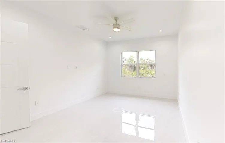 Empty room with ceiling fan, recessed lighting, and baseboards