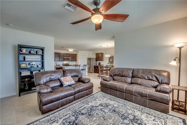 Tiled living room with ceiling fan