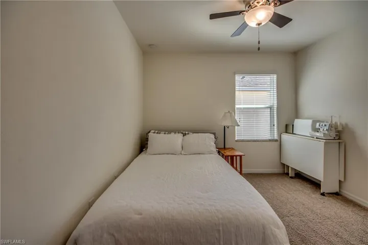 Bedroom featuring carpet and ceiling fan
