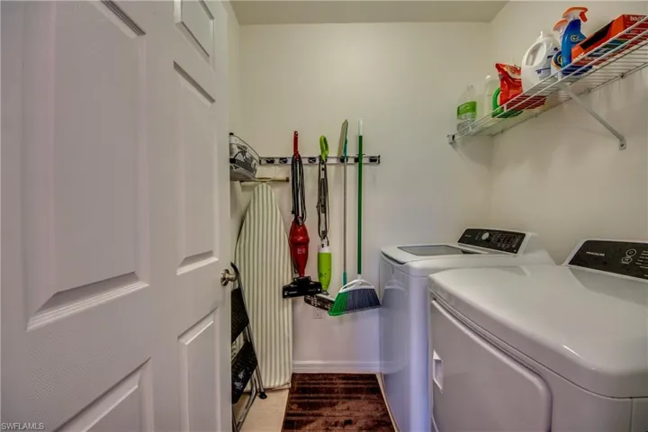 Laundry area with washer and clothes dryer