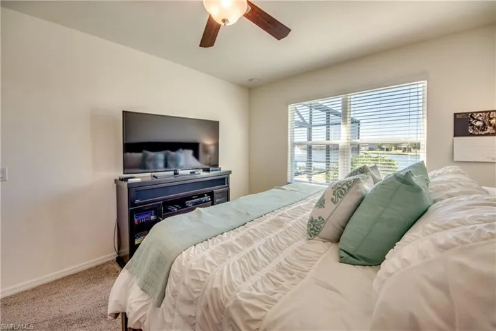 Bedroom featuring carpet flooring and ceiling fan