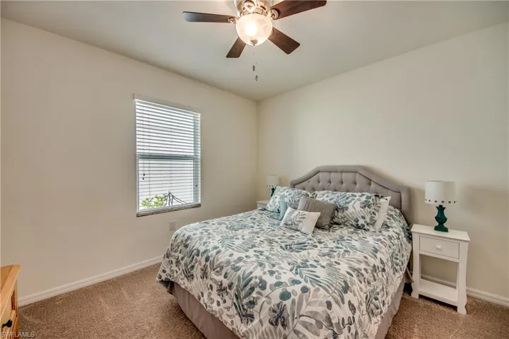 Bedroom with carpet floors and ceiling fan