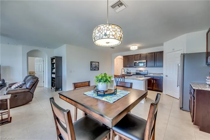 Dining room with light tile floors