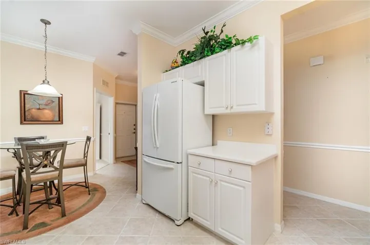 Kitchen with access to dinette and hall.