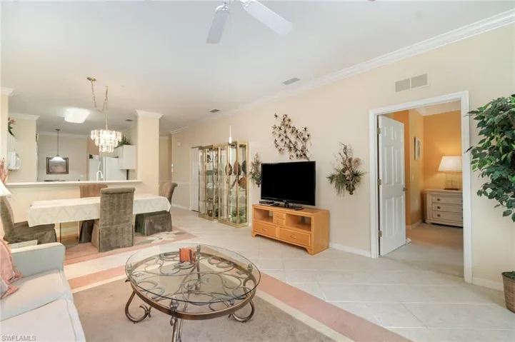 Living area featuring open dining room & breakfast bar open to the kitchen & dinette.
