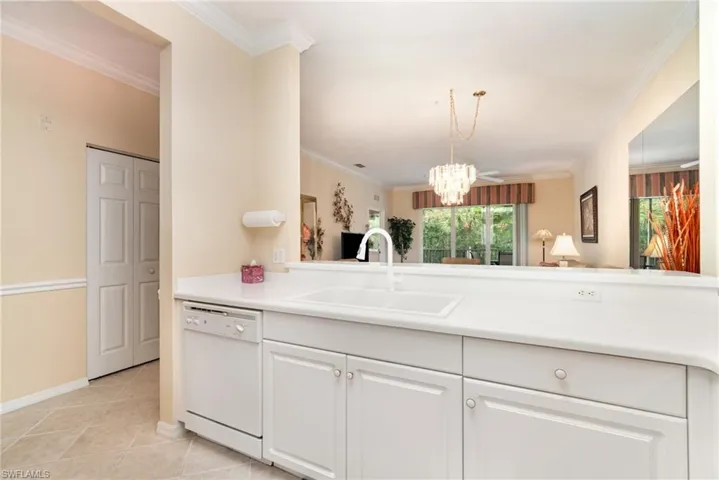 Kitchen featuring new sink and faucet and breakfast bar open to the great room.