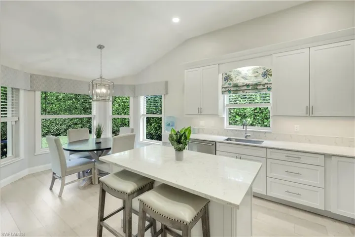 Kitchen with quartz counters, lots of storage and spacious eating area.