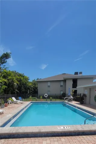 Community pool featuring a patio area