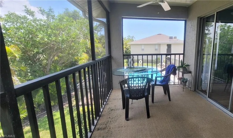 Balcony featuring ceiling fan