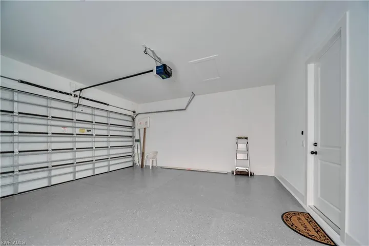 Garage featuring a garage door opener
