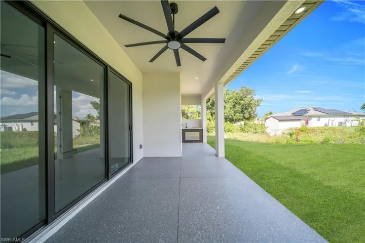 View of patio featuring ceiling fan