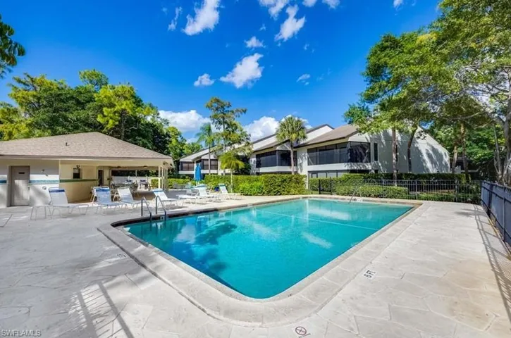 Community pool featuring a patio
