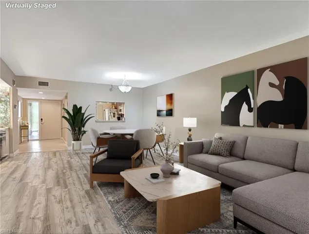 Living room featuring wood finished floors and baseboards
