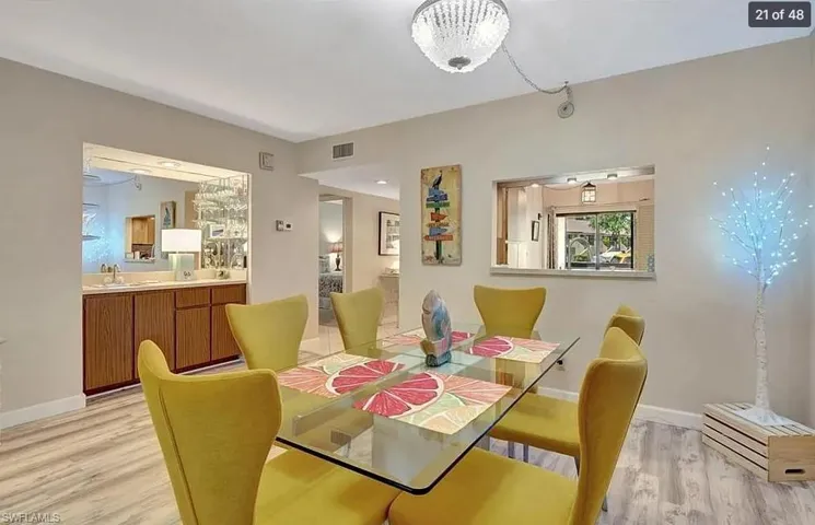 Dining room with light wood-style floors and baseboards