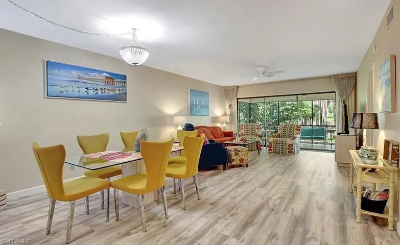 Dining space with light wood-style flooring and a ceiling fan