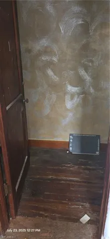 Detailed view of wood finished floors and baseboards