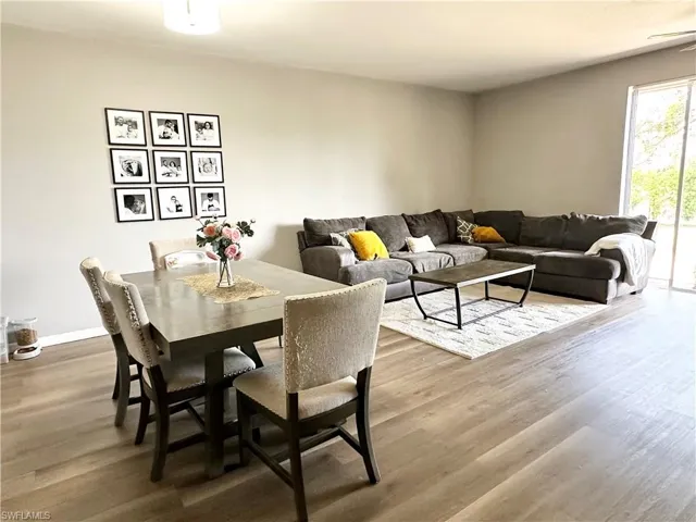 Dining room featuring wood finished floors and baseboards