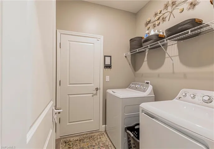 Clothes washing area with laundry area and washing machine and dryer