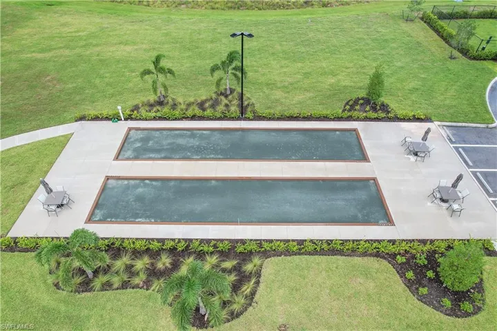 View of property's community featuring a lawn