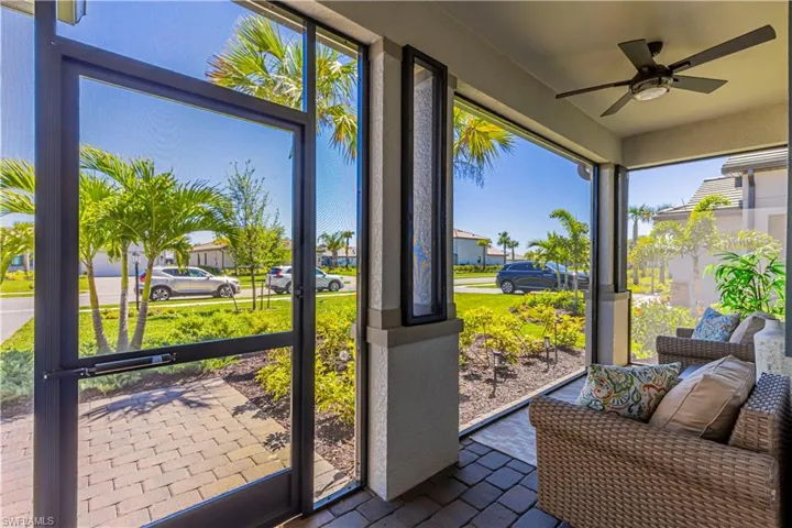 Sunroom featuring ceiling fan
