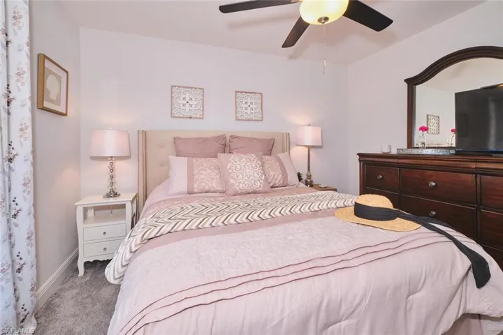 Bedroom featuring plush carpet flooring