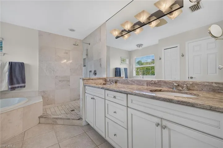 Dual vanity with undermount sinks and stone countertops