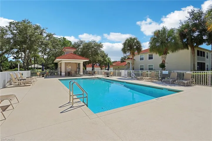 Community pool with a patio, a residential view, and a gazebo