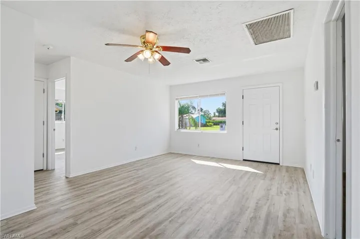 Bathroom with shower / bath combination and vanity