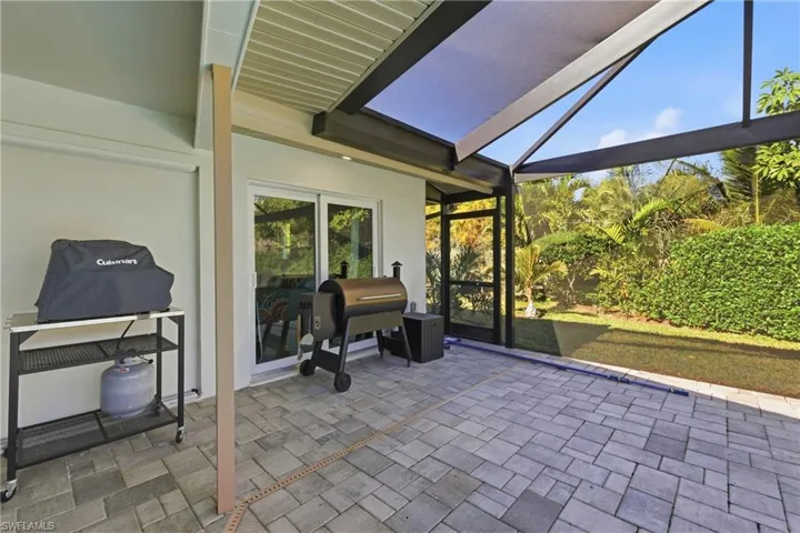 Screened Lanai with covered area for BBQing