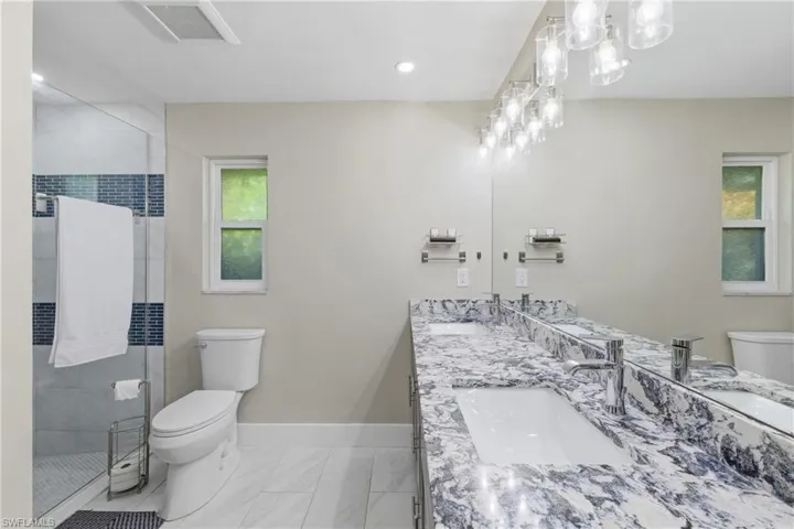Primary Bathroom with Dual Sinks and a Shower