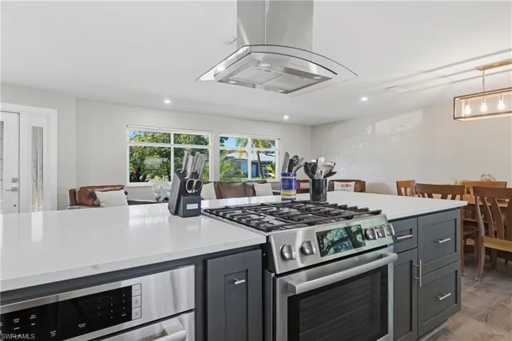 Kitchen featuring a gas range and a beautiful island
