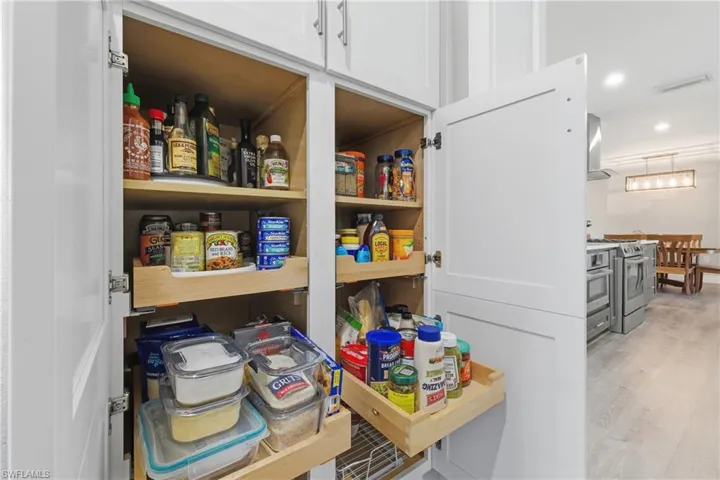 Butler's Pantry with plenty of cabinets with pull out shelving
