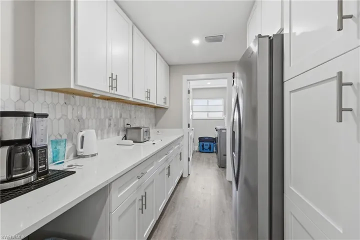 Butlers Pantry with 2nd Refrigerator, Cabinets with pull outs, and plenty of prep countertop.