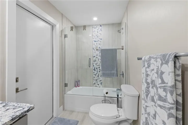Guest Bathroom with door to screened pool lanai