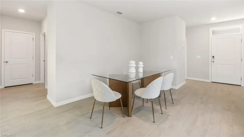 Dining room with light hardwood / wood-style floors