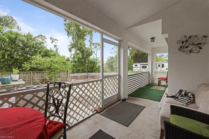 Sunroom / solarium with lofted ceiling
