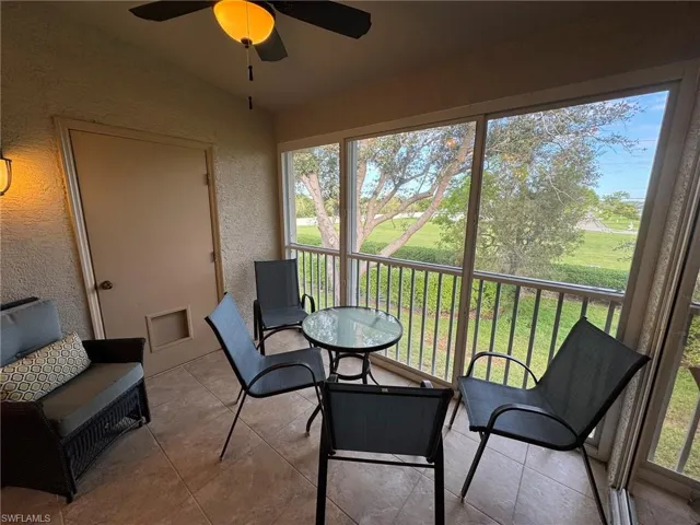 Sunroom featuring ceiling fan