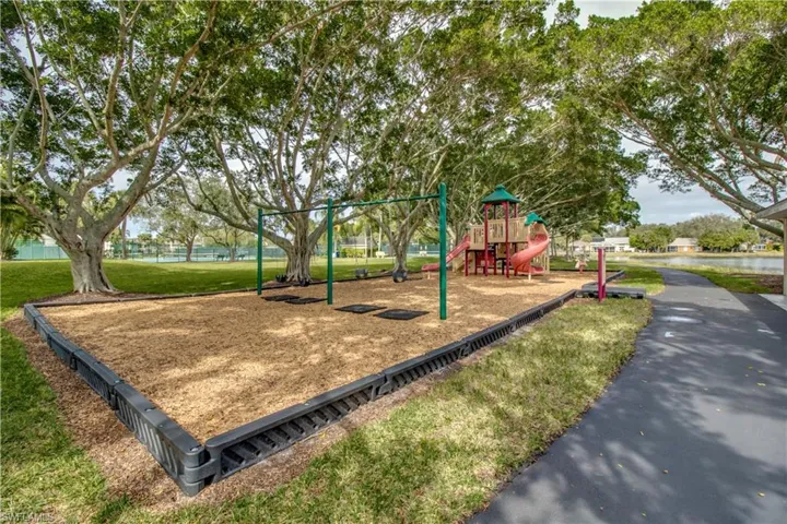 View of playground featuring a yard