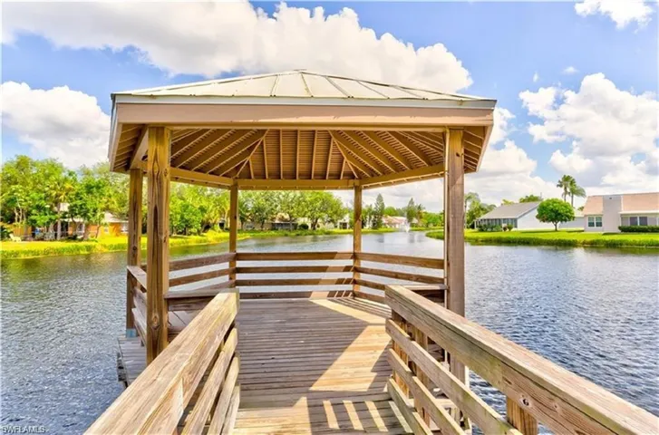 Dock fishing area with a gazebo and a water view
