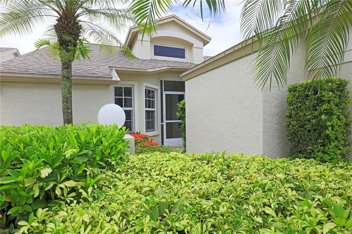 Property entrance with stucco