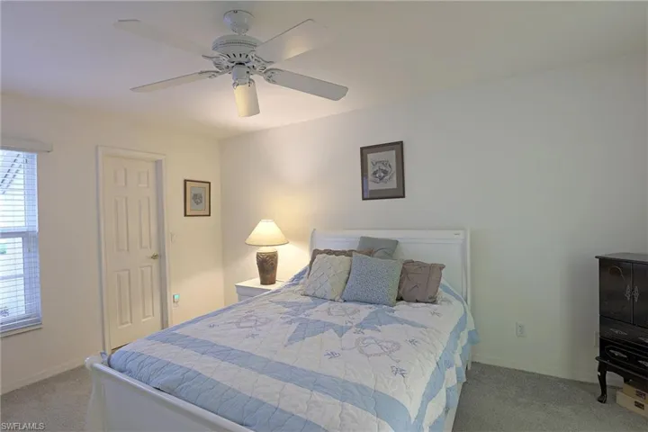 Bedroom featuring carpet and ceiling fan