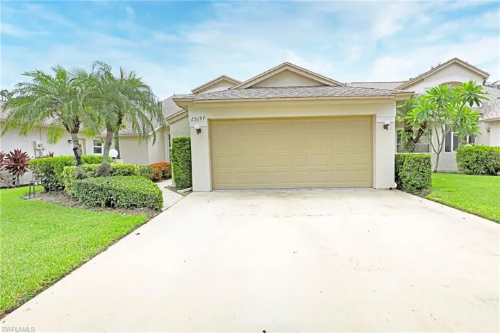 Ranch-style house featuring a garage, driveway, a front yard, stucco, and roof with shingles
