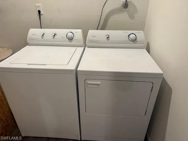 Laundry room featuring separate washer and dryer