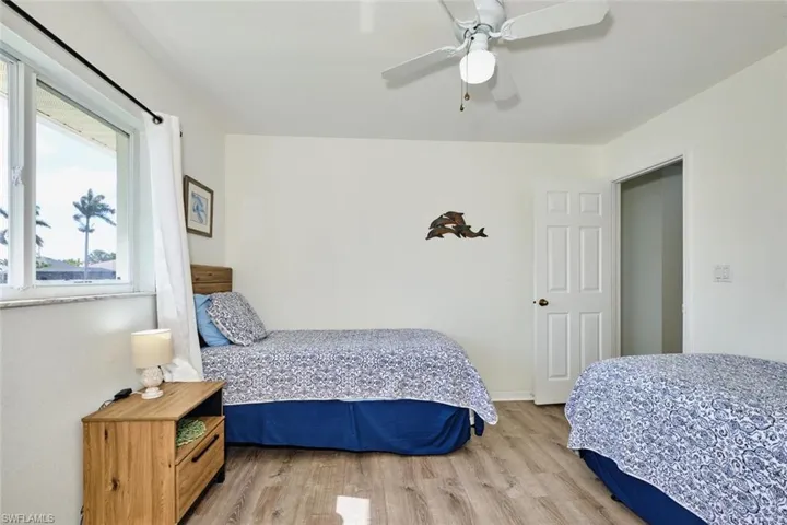 Bedroom featuring light wood-style floors and a ceiling fan